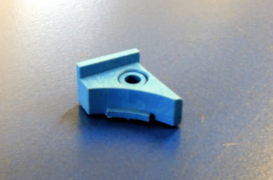 Milk meter sample tap retainer